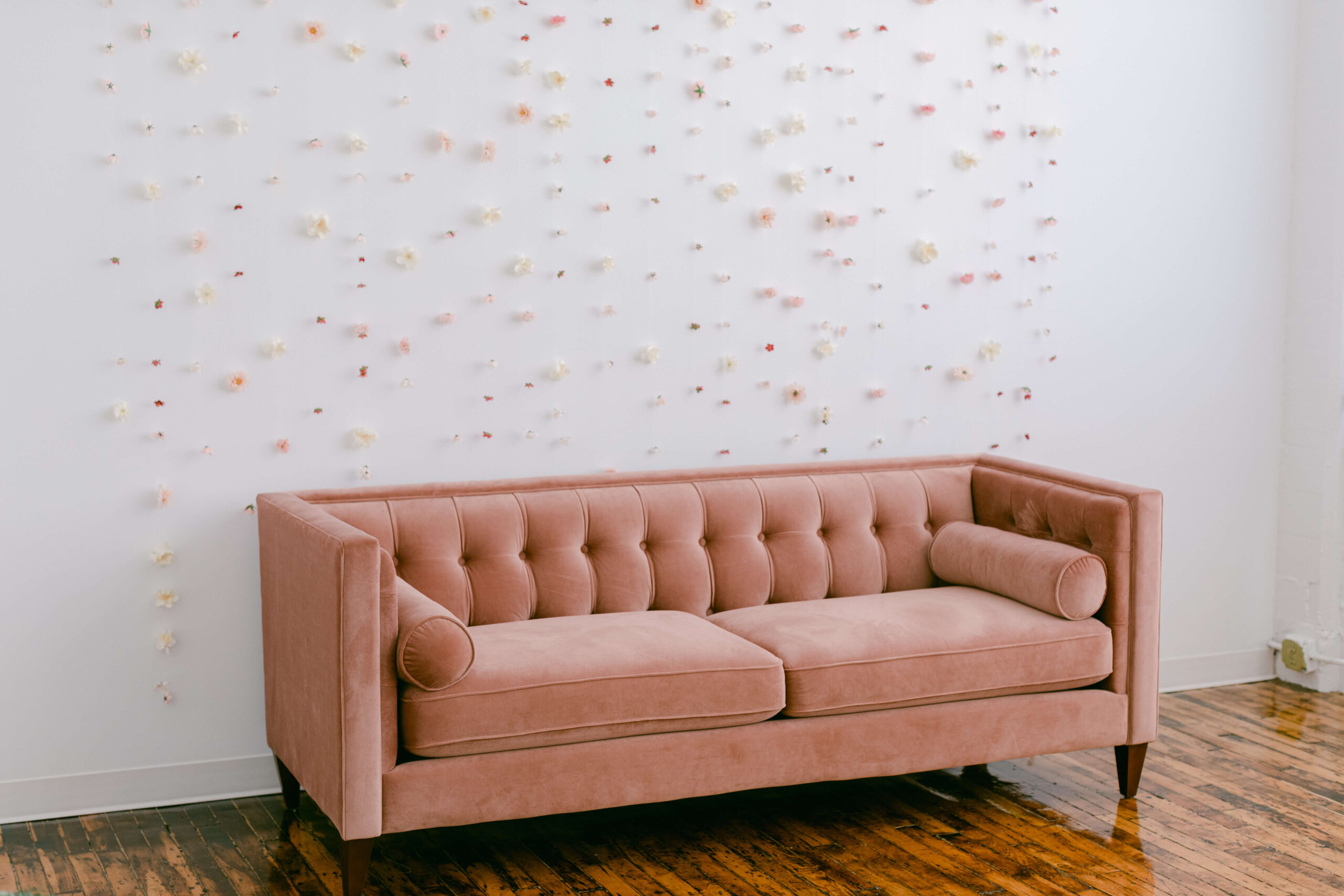 A pink couch will be able to rent from Rent Pearl as well as other luxury furniture